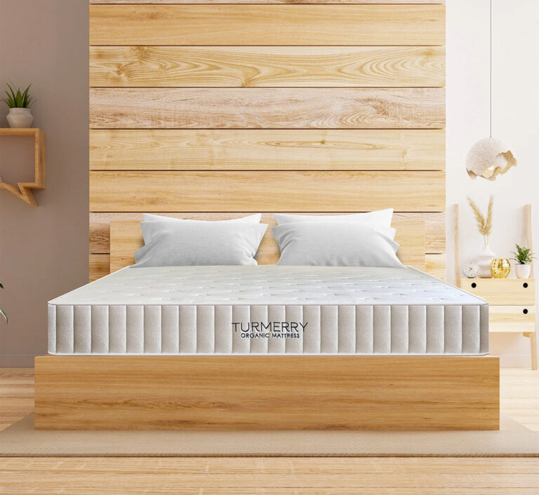 Turmerry Organic Latex Hybrid Mattress displayed on a wooden bed