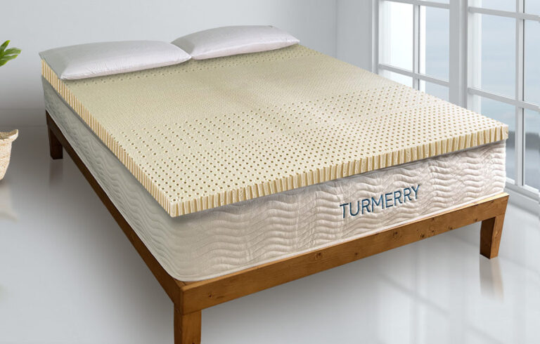 Turmerry perforated organic latex topper on top of a mattress