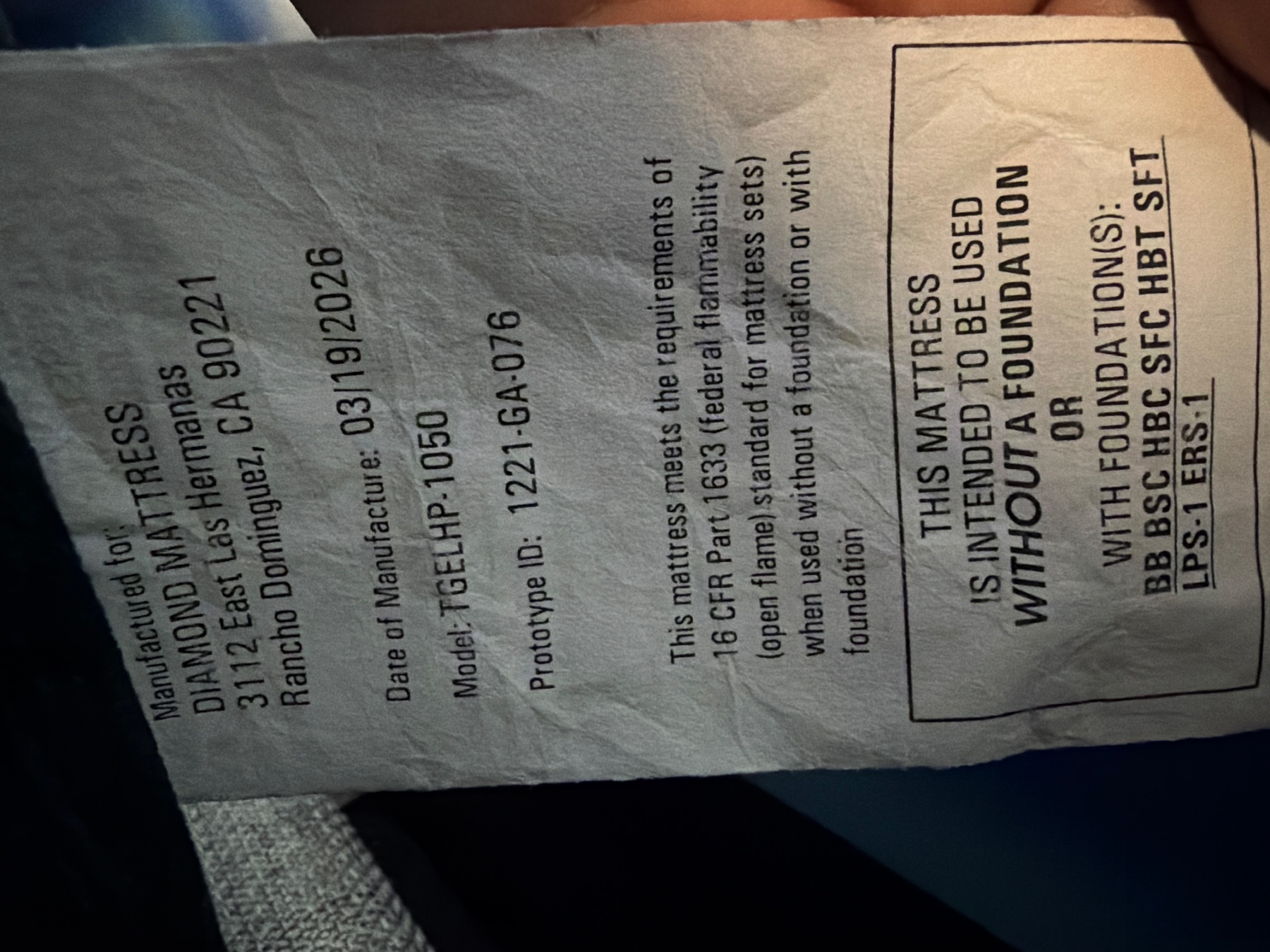 Mattress law label showing Diamond Mattress manufacture info, model TGELHP-1050, and 16 CFR Part 1633 compliance.