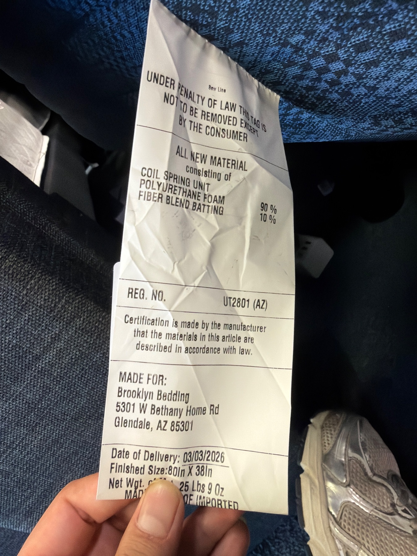 Mattress law label by Brooklyn Bedding detailing materials, dimensions, and registration number.
